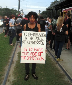New Orleans stands with Palestine protest on Aug 1. Protestor holds her sign to show support. 